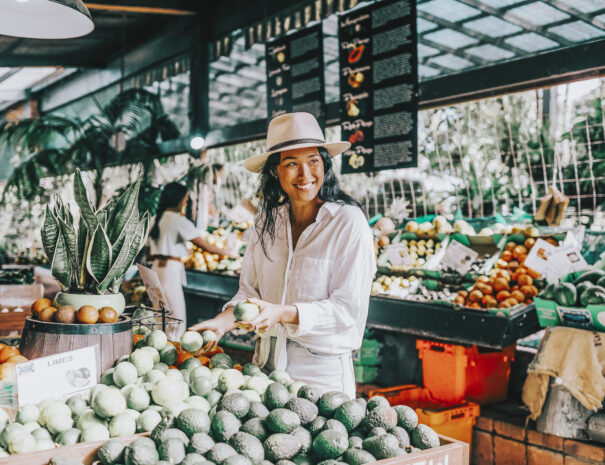 Woman purchasing fresh produce from Tropical Fruit World, Duranbah.