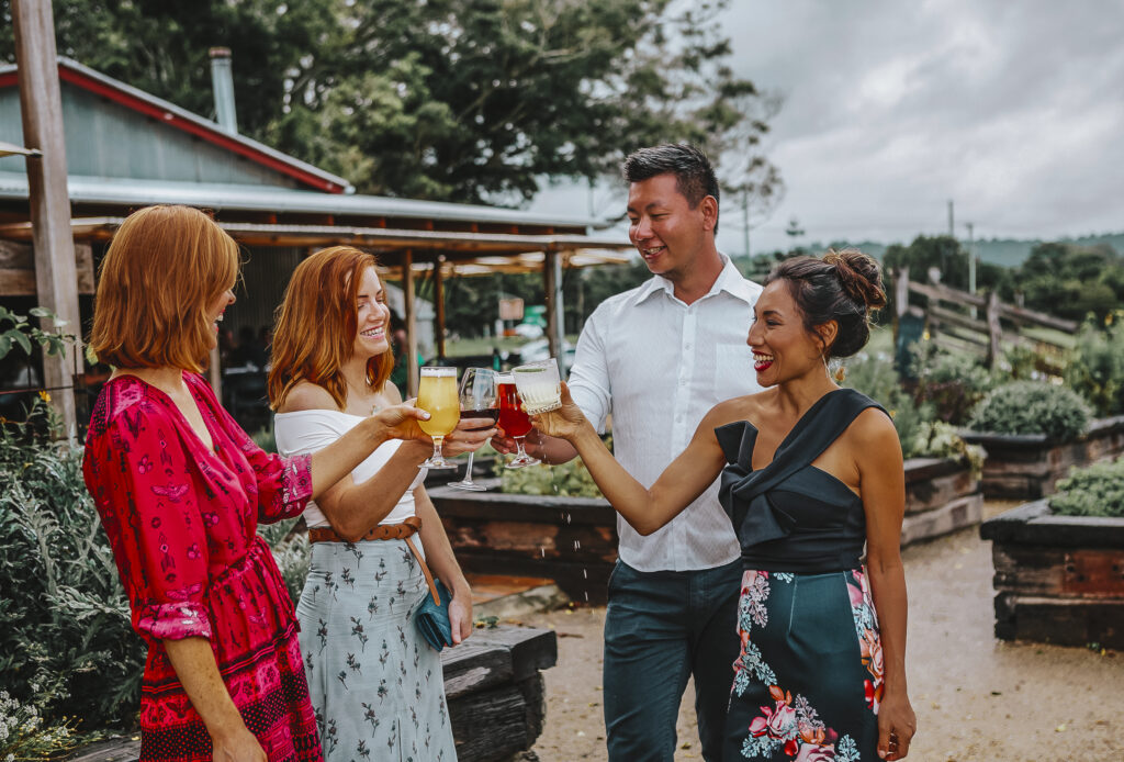 Friends enjoying a drink at The Farm, Byron Bay.