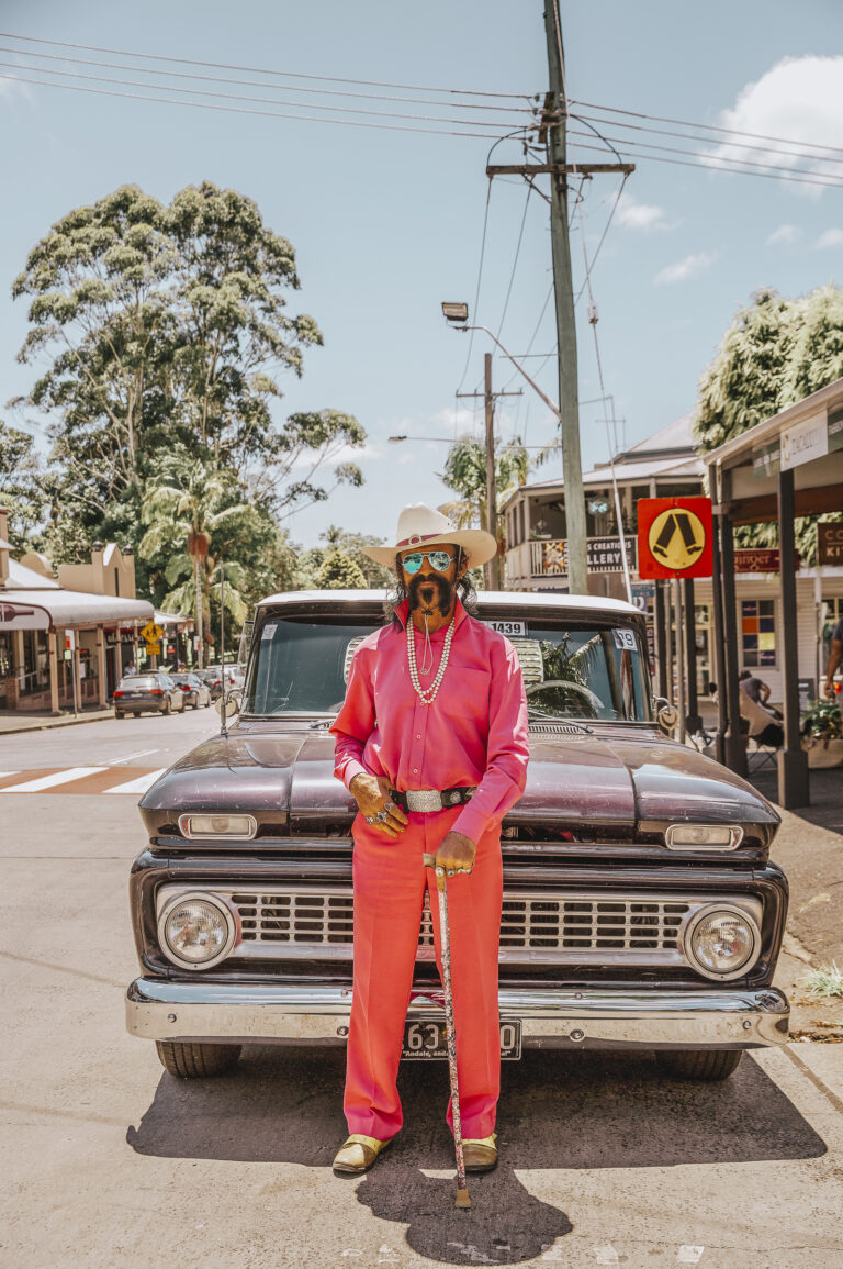 Man standing in front of Chevrolet ute in Bangalow, in the Byron Bay Shire.