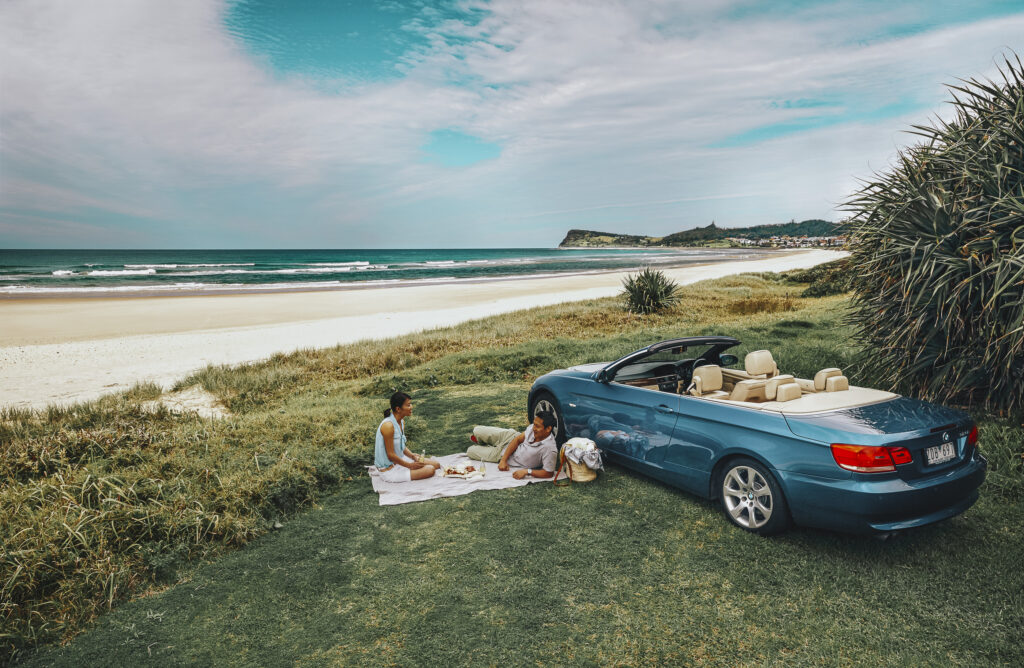 Couple enjoying a picnic overlooking Lennox Head Beach, Lennox Head.